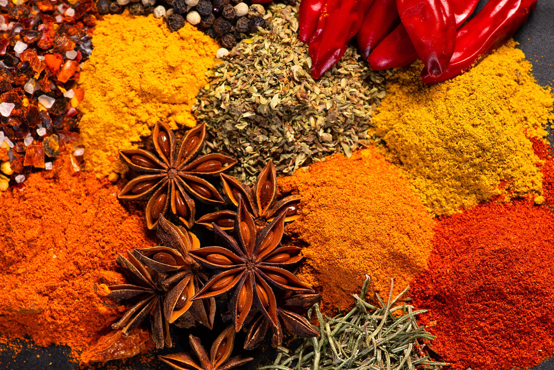 Healthy spice concept.Assorted variety of spices on a dark background .Assortment of natural spices.